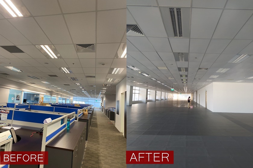 Workamn painting wall indoors